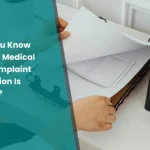Medical device complaint investigation adequacy, with a professional reviewing complaint documentation and quality records.