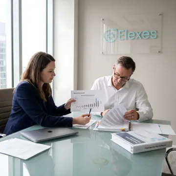 Regulatory team reviewing PSUR compliance documents